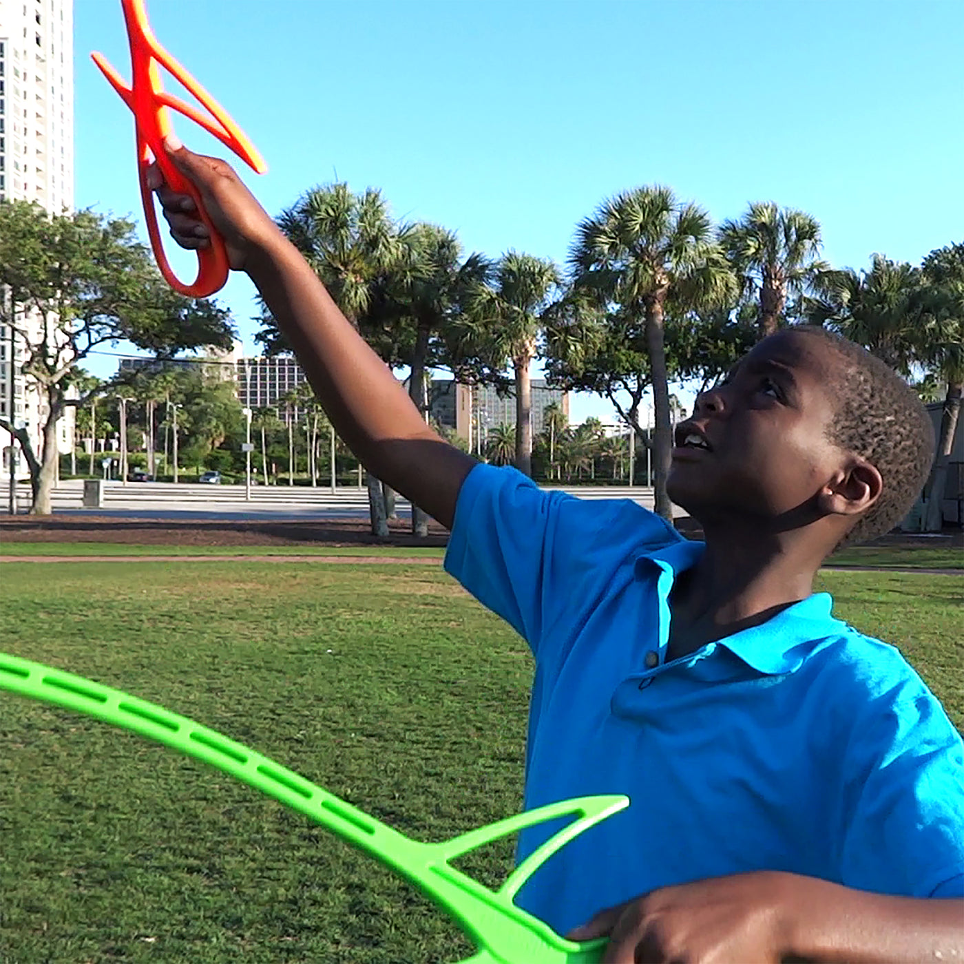 Kid playing RingStix at the park