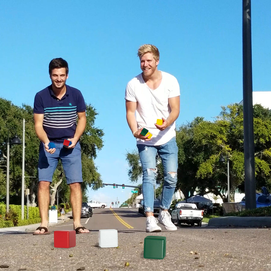 Friends playing Crazy Bocce on the driveway