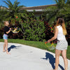 Siblings playing Switch Ball in the front yard by Funsparks