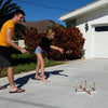 Siblings playing Ring Toss Deluxe by Funsparks in the front yard