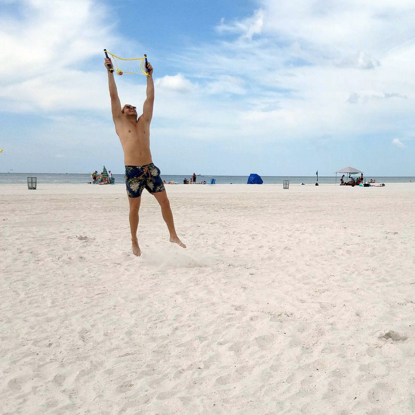 Guy jumping in air to hit ball for Switch Ball by Funsparks