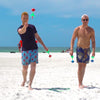 Friends playing Lawn Darts at the Beach