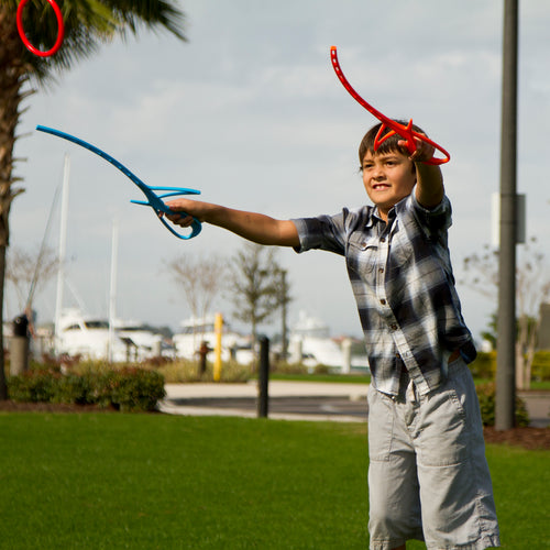Kid tossing RingStix Ring having fun in the park