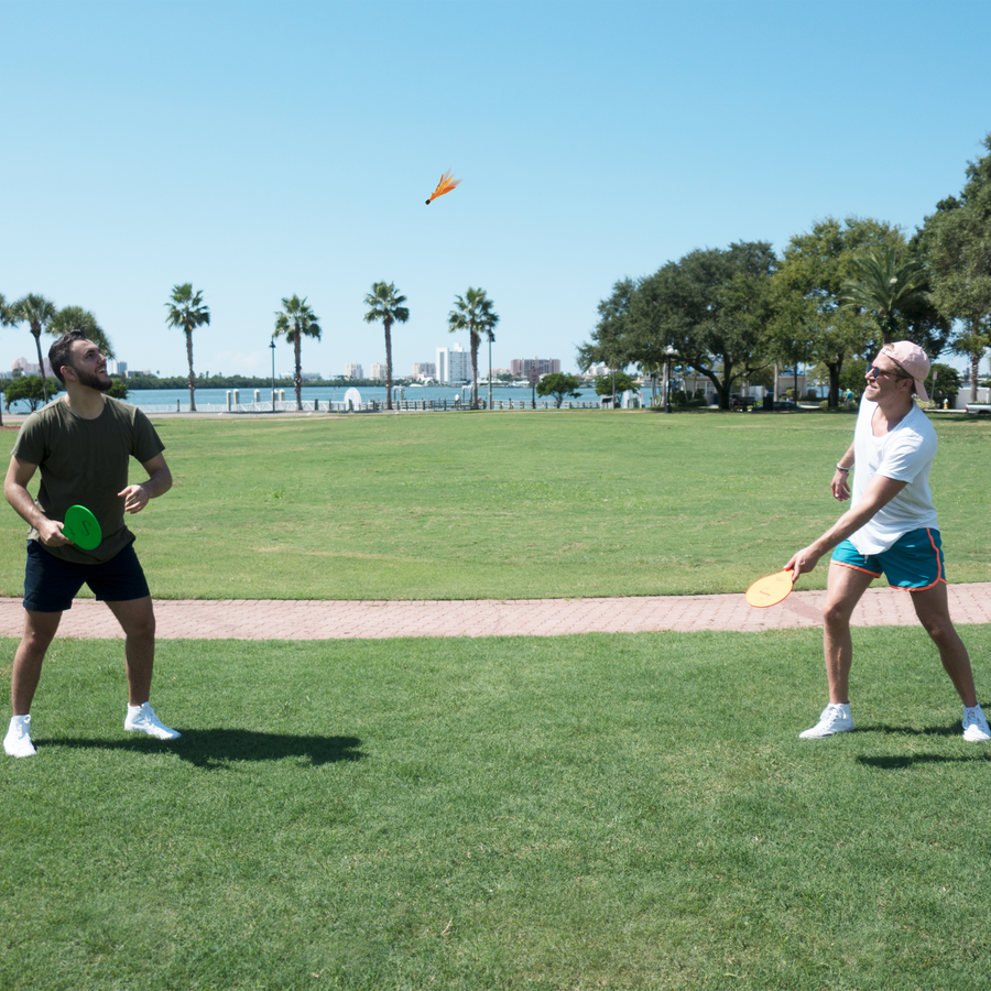 friends playing Jazzminton together at the park